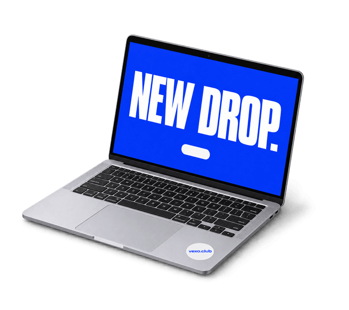 Open laptop showing a blue screen that reads “New drop.”